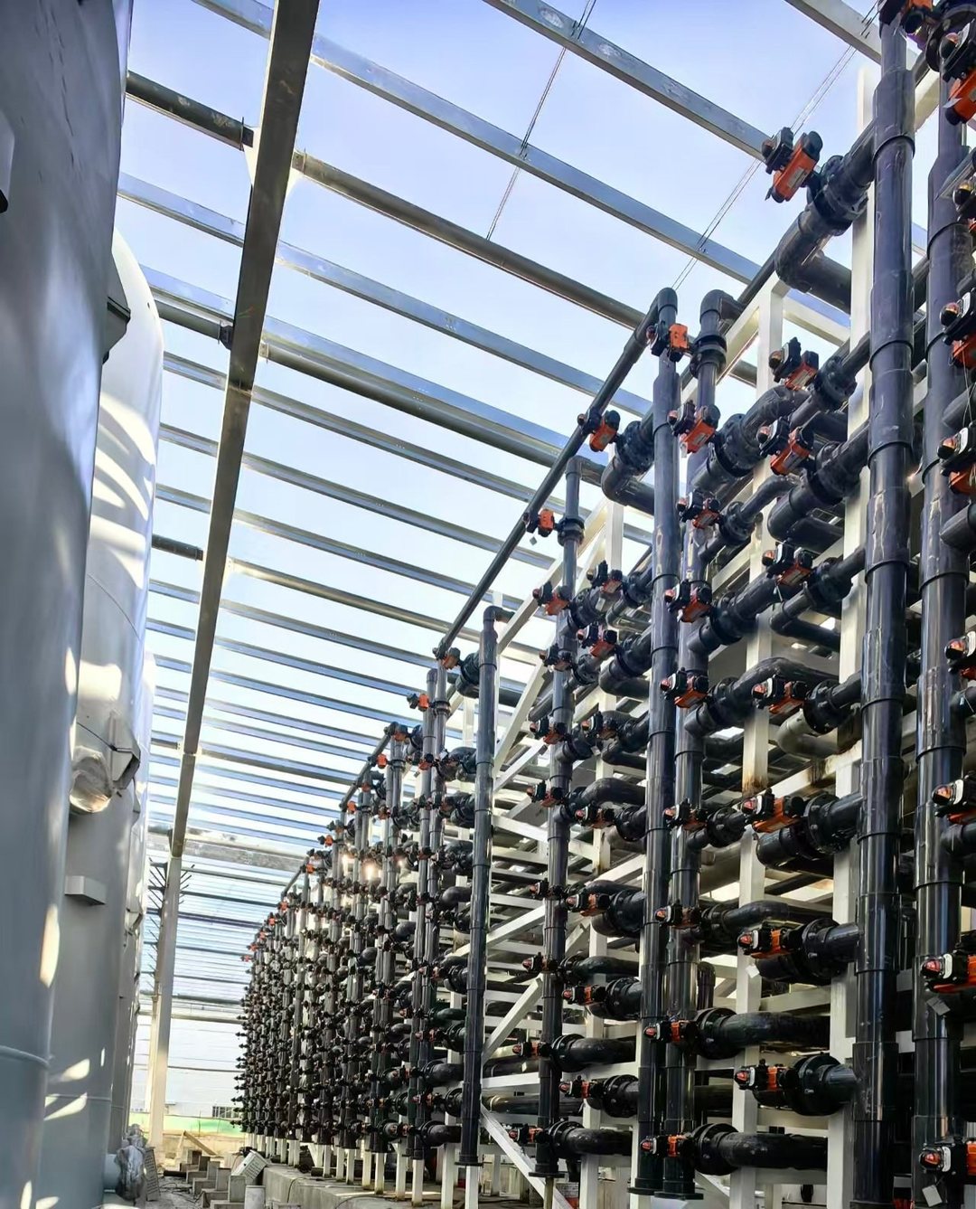 Panoramic view of a pipe-rack valve array on site